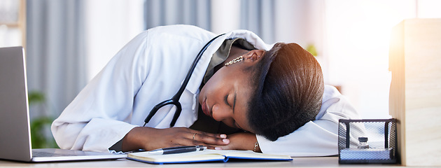 Image showing Tired doctor, woman and sleeping on desk in clinic office with stress, rest and dream in workplace. Overworked medic, fatigue and burnout in hospital, table and break for mental health in wellness