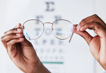 Image showing Hands, person and optometrist with glasses for vision, eye care and eyesight prescription. Closeup of optician, doctor and lens frame for eyewear, test and consulting of optical healthcare assessment