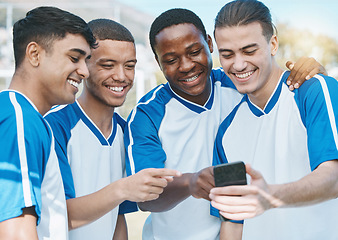 Image showing Happy man, friends and soccer team with phone for social media, communication or online browsing outdoors. Group of football players smile on mobile smartphone app together after workout practice