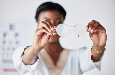 Image showing Hands, woman and optician with glasses for vision, eyesight and eye care prescription lens. Closeup of doctor, optometrist and frame for eyewear, test and consulting for optical assessment in clinic