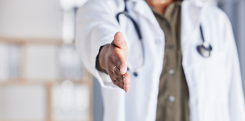 Image showing Hand, doctor and closeup greeting for healthcare, medical support or meeting at a hospital. Medicine, hello and a nurse or surgeon with a handshake, welcome or help during a consultation at a clinic