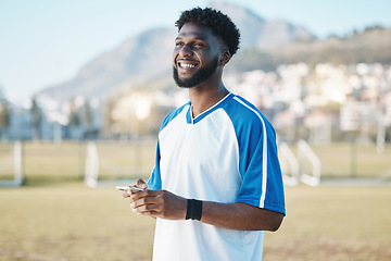 Image showing Fitness, phone or soccer player on field on social media, blog post or texting on internet or online chat. Black man, football or happy African athlete thinking of mobile app in match or sports game