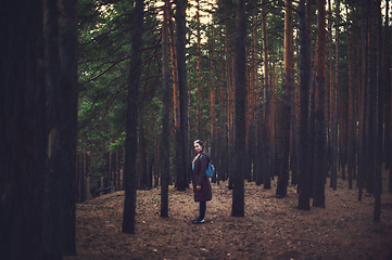 Image showing Pretty happy woman in forest