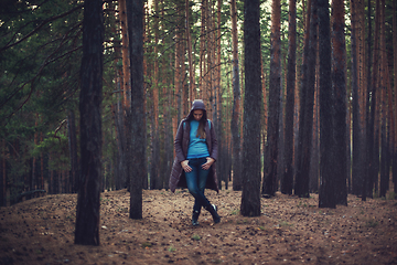 Image showing Pretty happy woman in forest