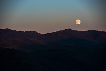 Image showing Full moon at sunset