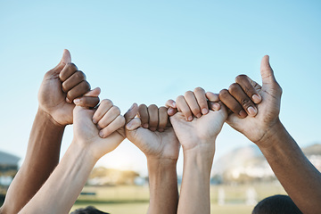 Image showing Fist, hands and group with diversity for outdoor celebration or team building together for support, motivation and solidarity. Hand, ready for sport or teamwork with community of people on blue sky