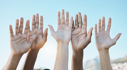 Image showing Diversity, palm of hands and group for outdoor celebration or team building together for support, motivation and solidarity. Raised hand, question or community of people on blue sky background