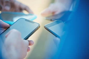 Image showing Hands, phone and networking with people in a huddle or circle for communication or connectivity. Mobile, social media or information sharing and a person group standing together closeup with flare