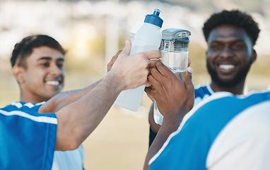 Image showing Success, happy and men in soccer with water bottle after a game, sports win or celebration after training. Smile, drink and athlete people with a toast for achievement, motivation or goal in football