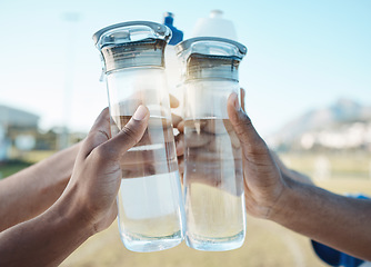 Image showing Fitness, water bottle or hands toast in stadium together after workout, exercise or training game outdoors. Sports target, cheers or closeup of team with liquid for hydration in celebration of goals
