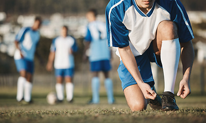 Image showing Tie, man or soccer player with shoes on football field in training, exercise or workout in Brazil. Lace, stadium or hands of athlete ready to start fitness match or sports game with boots or footwear