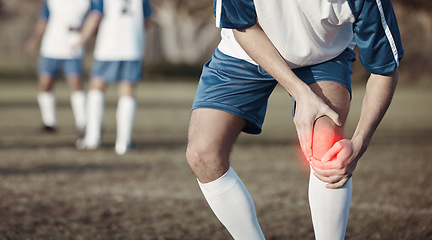 Image showing Soccer player, knee pain or man with injury on field in sports training accident or workout game emergency. Closeup, red glow or injured football athlete suffering from leg muscle in fitness exercise