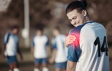 Image showing Soccer player, shoulder pain or man with injury on field in sports training accident or workout game. Emergency, red glow or injured football athlete suffering from arm muscle in fitness exercise