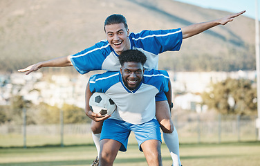 Image showing Soccer player, support or team in celebration for goal, victory or success on a field in sports game together. Black man, piggyback or excited football players winning a fitness match achievement