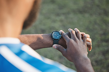 Image showing Hands, man or soccer player with smart watch on field to monitor time, training or exercise progress. Wellness, performance or healthy sports athlete with timer to check running workout or fitness