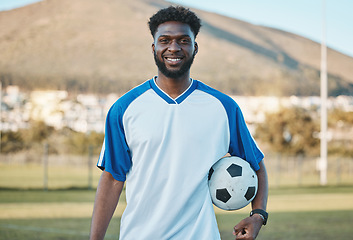 Image showing Soccer ball, football player or portrait of black man with smile in sports training, game or match on pitch. Happy, fitness or proud African athlete in practice, exercise or workout on grass field
