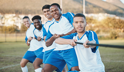 Image showing Soccer player, men and tug of war on field with teamwork, strong and muscle, fitness and competition challenge. Male athlete group, football training and diversity, trust and team building in sports