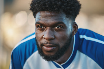 Image showing Soccer player, thinking or tired black man in sports training, game or match breathing on a field pitch. Face, fatigue or exhausted African athlete in football workout or fitness exercise on break