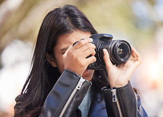 Image showing Nature, photography and woman in park with camera, trees, art and creative influencer with inspiration focus in media. Girl, photographer or content creator in garden taking picture for social media.