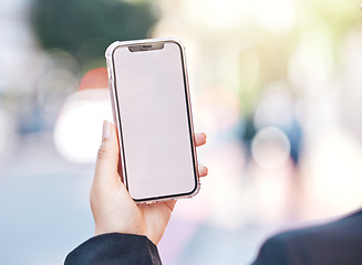 Image showing Woman, hands and phone with mockup screen in city for advertising, social media or outdoor communication. Closeup of female person or mobile smartphone display for online app or network in urban town