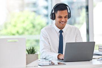 Image showing Businessman, laptop and typing email with headphones in communication, networking or listening to music at office. Happy man, accountant or financial advisor working on computer for business proposal