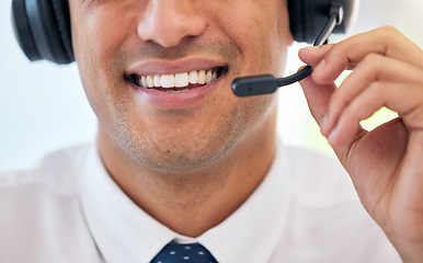 Image showing Happy man, smile and headphones with mic in call center for customer service, support or telemarketing at office. Closeup of male person, consultant or agent mouth for friendly online advice or help