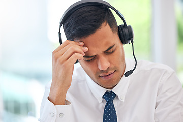 Image showing Call center, customer service and man with a headache or businessman with stress, burnout or working with fatigue. Tired, exhausted or consultant in office with a migraine, pain or anxiety from crm