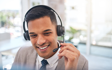 Image showing Happy man, call center and headphones in customer service, support or telemarketing on mic at office. Friendly male person or consultant agent smile for online advice, help or contact us at workplace