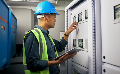 Image showing Technician, tablet and man, control room and inspection, maintenance check with power supply and engineering. Electricity, industrial and male electrician, digital assessment and quality assurance