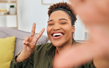 Image showing Portrait, happy black woman and peace for selfie in home, online live streaming and influencer. Face of female gen z smile for profile picture, v sign and hand emoji for memory of social media post