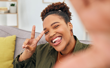 Image showing Portrait, happy black woman and peace for selfie in living room, live streaming and home vlog. Face of female gen z show v sign, hand emoji and tongue out for memory, profile picture and social media