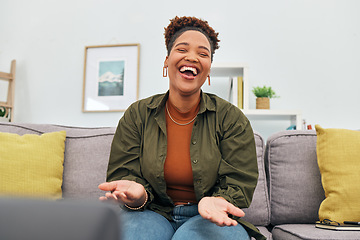 Image showing Comic, happy or funny with a black woman laughing while sitting on a sofa in the living room of her home. Comedy, smile and freedom with a carefree young female person joking eyes closed in her house