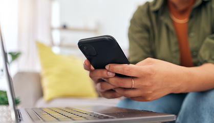 Image showing Hands of woman on sofa with phone, laptop and typing for remote work, research and documents for online job. Internet, networking and home office, freelancer on couch with cellphone and computer.