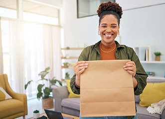 Image showing Fast food, delivery and portrait of happy black woman with package order in her home, Smile, face and African lady customer with deliver bag from online shopping, ecommerce or satisfaction in house