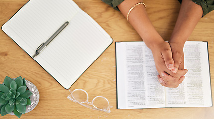 Image showing Woman hands, bible and prayer in top view of spiritual faith, holy gospel and trust to worship God. Closeup of person praying with christian books, studying religion or reading praise to jesus christ