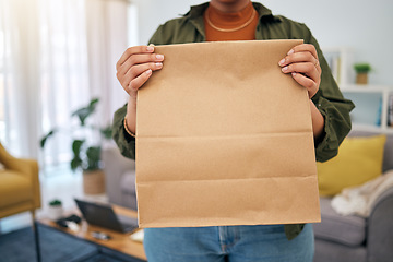Image showing Delivery, fast food and woman with hand holding package order at home. Closeup, parcel and customer with paper bag from online shopping, ecommerce with mockup space for branding, advertising or logo