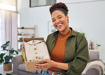 Image showing Online shopping, portrait of happy woman and unboxing package, discount fashion retail and smile in living room. Delivery of clothes, ecommerce and girl in lounge with box from website sale or deal.