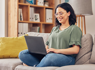 Image showing Sofa, laptop and woman or student in e learning, online education and typing for university or work from home research. Computer, information or knowledge of young person on couch and college website