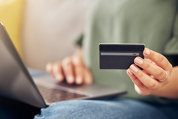 Image showing Hands, credit card and laptop on sofa, home and closeup for online shopping, sale or payment with internet banking. Woman, pc and fintech app for cybersecurity, discount or deal with e commerce store