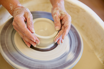 Image showing Creating a masterpiece with her hands. Cropped shot of a woman making a ceramic pot in a workshop.