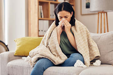 Image showing Tissue, blow nose and woman on sofa for home self care with virus, sick and healthcare or allergies. Sinus, flu and person on living room couch with allergy for medical or health and wellness risk