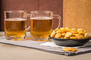 Image showing Tasty lupins and glass of beer