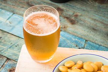 Image showing Tasty lupins and glass of beer