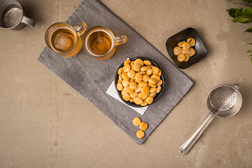 Image showing Tasty lupins and glass of beer