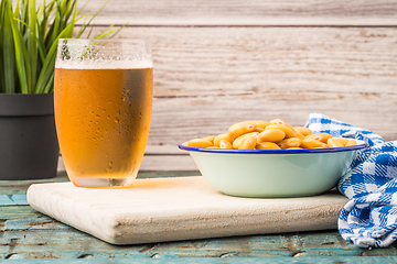 Image showing Tasty lupins and glass of beer