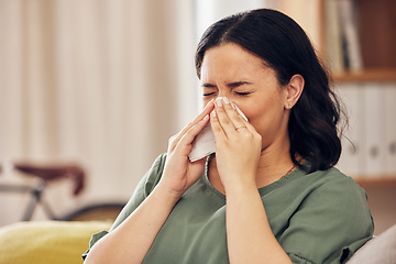 Image showing Sick, allergy and blowing nose with woman on sofa for virus, hayfever or illness. Healthcare, disease and allergies with person and sneezing with tissue in living room at home for influenza and sinus