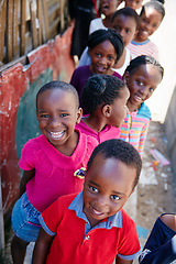 Image showing They always seem to be smiling. Cropped portrait of a group of kids at a community outreach event.