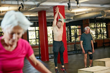 Image showing Theres no cant in this gym. Shot of a group of people working out at the gym.