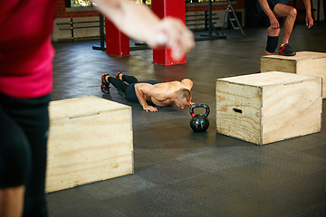 Image showing Muscles are his motivation. Shot of a shirtless man doing push ups during his workout at the gym.