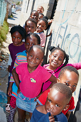 Image showing The faces of our future. Cropped portrait of a group of kids at a community outreach event.